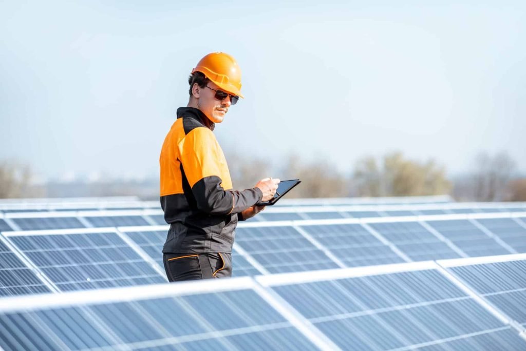 engineer-servicing-solar-panel-on-electric-plant.jpg